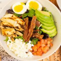 Cobb Salad · Chicken, egg, avocado, bacon, feta, mixed greens, tomato, and olive oil.