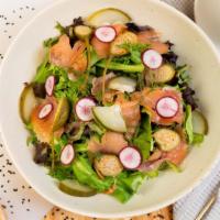 Smoked Salmon Salad · Radishes, spinach, mixed greens, pickled cucumbers, dill, and bread.
