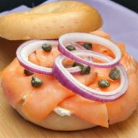 Salmon Bagel · Salmon, cream cheese, red onion, capers and dill on a bagel.