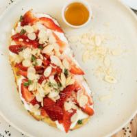 Strawberry Toast · Ricotta, honey, shaved almonds, and thyme.