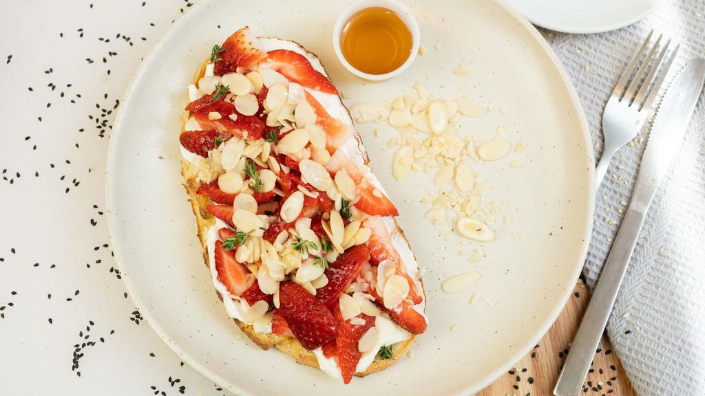 Strawberry Toast · Ricotta, honey, shaved almonds, and thyme.