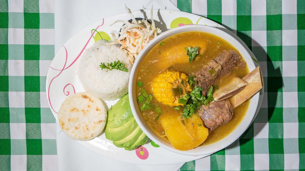 Sancocho De Costilla (Res) · Fresh Short Ribs Soup 
Served every day with white rice, corn paty & avocado