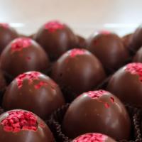 Raspberry Truffle · Milk chocolate truffle blended with pure raspberry juice in a darker milk chocolate shell, t...