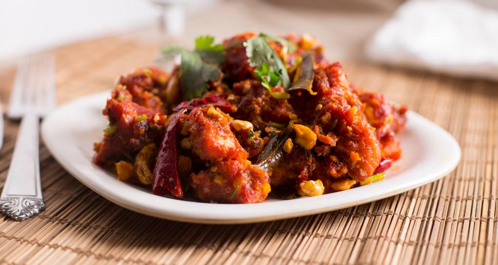 Guntur Chicken · Spicy. Boneless chicken sautéed with dry red chilies and curry leaves.
