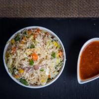 Veg Fried Rice · Aromatic rice stir fried with fine chopped cabbage, carrots, bell peppers & veggies.