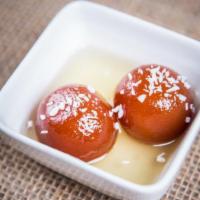 Gulab Jamun · Traditional deep fried milk pastry served in rose water honey syrup.