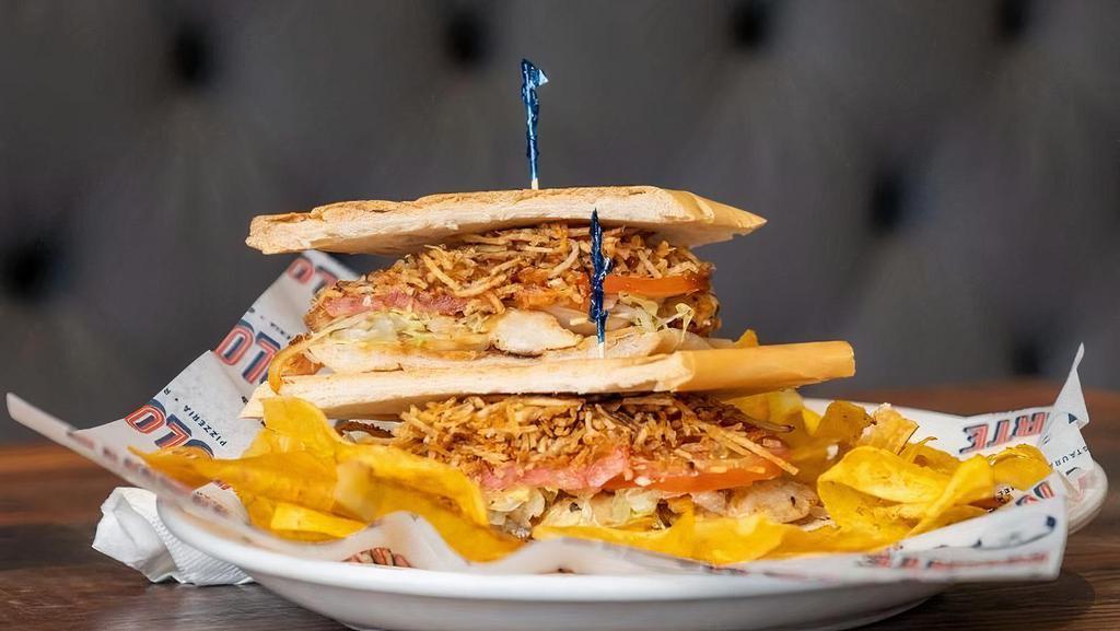 Sandwich De Pollo Especial · Grilled chicken sandwich topped with ham, cheese, onions, lettuce, tomatoes and julianne fries.