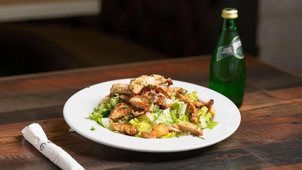 Chicken Caesar Salad · Fresh Romaine lettuce, parmesan cheese, croutons and creamy Caesar dressing with grilled chicken.