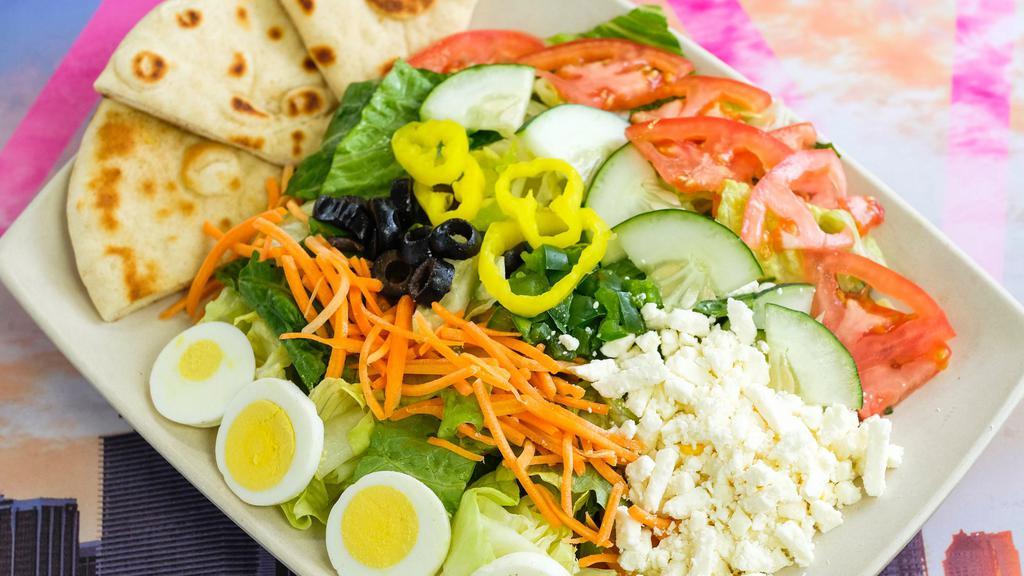 Greek Salad · Garden salad, mixed with feta cheese, black olives, green peppers, and banana peppers. Topped with your choice of dressing.
