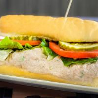 Tuna Sub · Served with lettuce, tomato, pickles, on a baked Italian or multigrain roll. Combination of ...