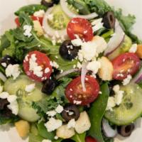 Athena Salad · Greens, feta cheese, tomatoes, cucumbers, black olives, and red onions.