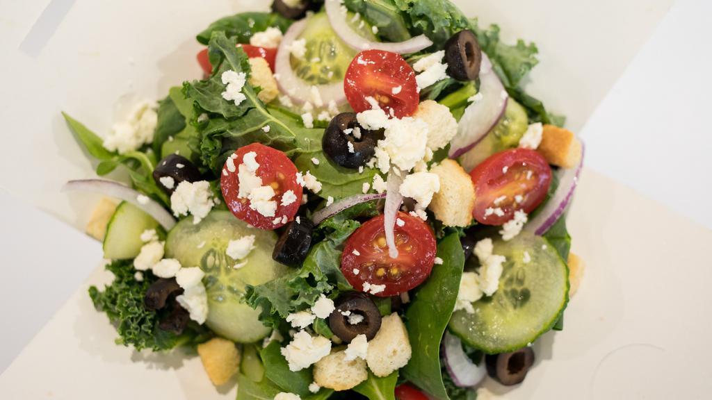 Athena Salad · Greens, feta cheese, tomatoes, cucumbers, black olives, and red onions.