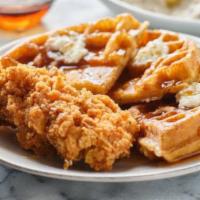 Chicken & Waffles · Waffle topped with two crispy chicken tenders, topped with maple sour cream.
