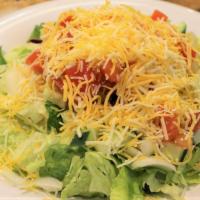 Tossed · Lettuce mix, cucumbers, onions, tomatoes, cheddar cheese, and your choice of dressing on the...