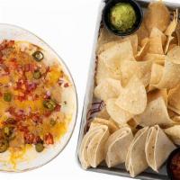 Nachos All The Way · Seasoned beef, chili, black beans, queso, cheese, pico de gallo, pickled jalapeños, served w...