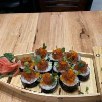 Cruise Ship Roll · Tuna, Salmon, Hamachi, Top Ikura, scallions, Spicy tuna, Micro greens
