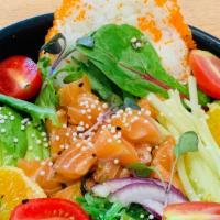 Oishii Salmon Poke Bowl · Salmon , spring mix salad, Seaweed salad,  sushi rice, edamame, cherry tomato, red onions, s...
