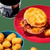 Bacon, Egg & Cheese Biscuit Combo · You can’t beat a biscuit with bacon, egg and cheese. Combo includes crispy Tots, rich and fl...