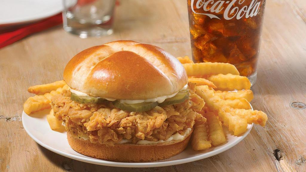 Chicken Sandwich Combo  Spicy · We placed over 65 years of delicious into this sandwich.  Taste our legendary hand-battered chicken, topped with a signature honey-butter brushed brioche bun with mayo and pickles.  Served with regular side and large drink.