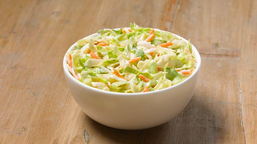 Cole Slaw · Creamy, tangy and delicious. It’s the perfect way to cool down your mouth after taking a bite of our spicy chicken.