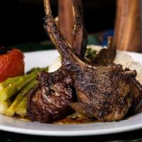 Lamb Chops · Four (4) pieces of grilled lamb chops served w/ basmati rice, asparagus, and mint oil sauce.