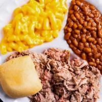 Pulled Pork Plate · Our famous Pulled Pork plate... plus two southern sides of your choice, a warm roll and a cu...