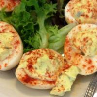 Deviled Eggs · Gluten free. Six halves on a bed of lettuce.