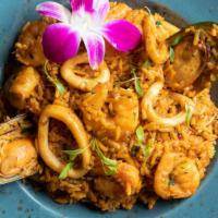 Arroz Con Mariscos · Shrimp, squid, mussels and scallops, all mixed with rice, red pepper, cilantro, and Peruvian...