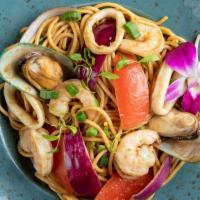 Tallarin Saltado Criollo De Mariscos · Peruvian stir-fried noodles, made with seafood, onions, tomatoes, cilantro, soy sauce, and g...
