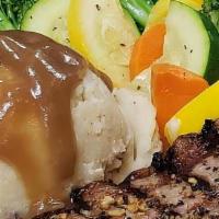 New York Strip Steak · Choice 14oz cut of New York Strip served with mashed potatoes and mixed vegetables