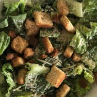 Large Caesar Salad (Cal 480) · Crisp romaine lettuce topped with shredded Parmesan cheese and croutons. Served with our hou...
