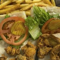 Oyster Po Boy (Cal 900) · Dressed with mayonnaise, lettuce, pickles and tomatoes and served with French Fries.