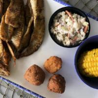 Flounder Platter (Cal 630) · Grilled, blackened or cajun, with our famous shrimp slaw, two hushpuppies, a corn fritter an...