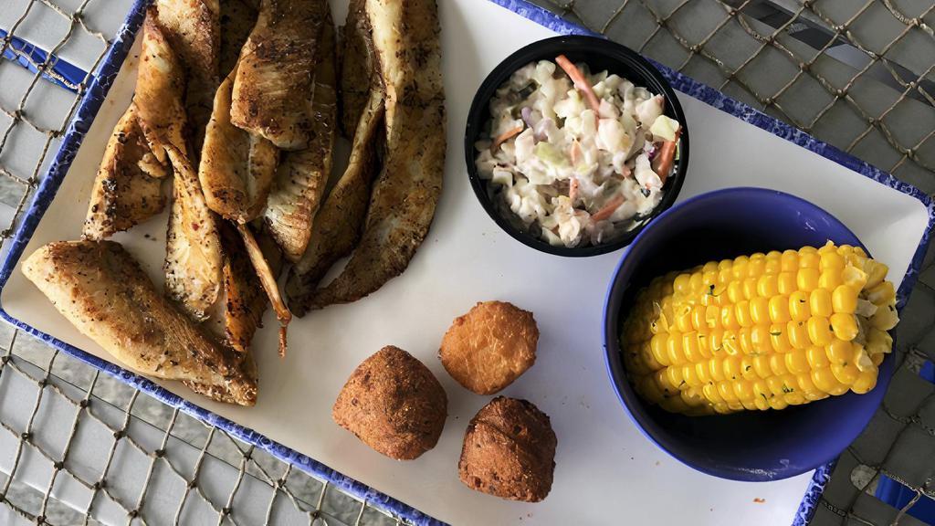 Flounder Platter (Cal 630) · Grilled, blackened or cajun, with our famous shrimp slaw, two hushpuppies, a corn fritter and your choice of an additional side