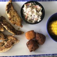 Chicken Strips Platter (Cal 670) · Grilled, blackened or cajun, with our famous shrimp slaw, two hushpuppies, a corn fritter an...