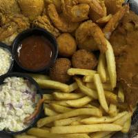 Seafood Basket (Cal 1100) · Shrimp, fish, oysters and stuffed crab served in a basket with fries, two hushpuppies, one c...
