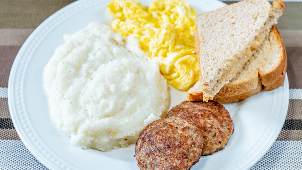 Sausage And Egg Breakfast · Breakfast consists of 2 sausage patties, 2 scrambled eggs, grits and 2 slices of toast