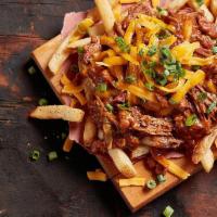 Brisket Chili Cheese Fries · Topped with brisket chili, cheddar cheese and scallions.