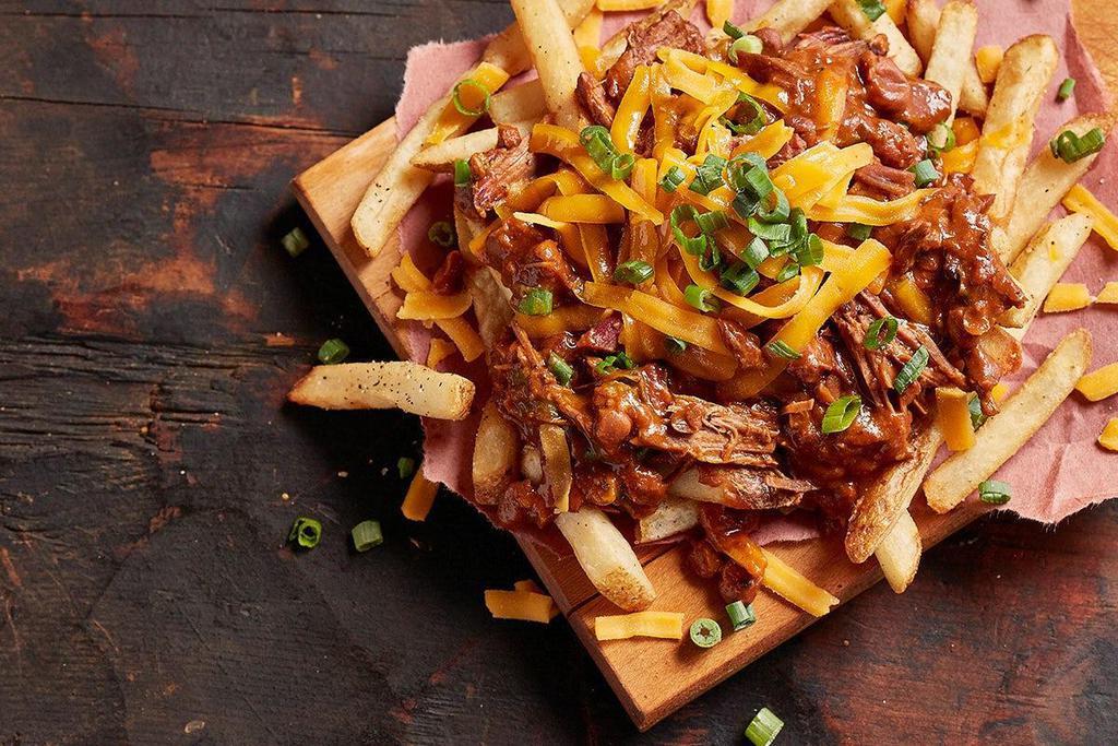 Brisket Chili Cheese Fries · Topped with brisket chili, cheddar cheese and scallions.