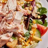 Chopped Southern Salad · Lettuce mix, smoked chicken, smoked onion and sweet corn, cheddar cheese, bacon, cucumber, t...