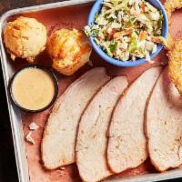 Smoked Turkey Breast W/Morgan Co. Sauce · Lean, smoky goodness served with Morgan Co. White sauce and 2 trimmings.