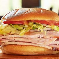 Joe'S Original Turkey Sandwich · Hickory-smoked turkey breast with lettuce, tomato and honey mustard on a bun.