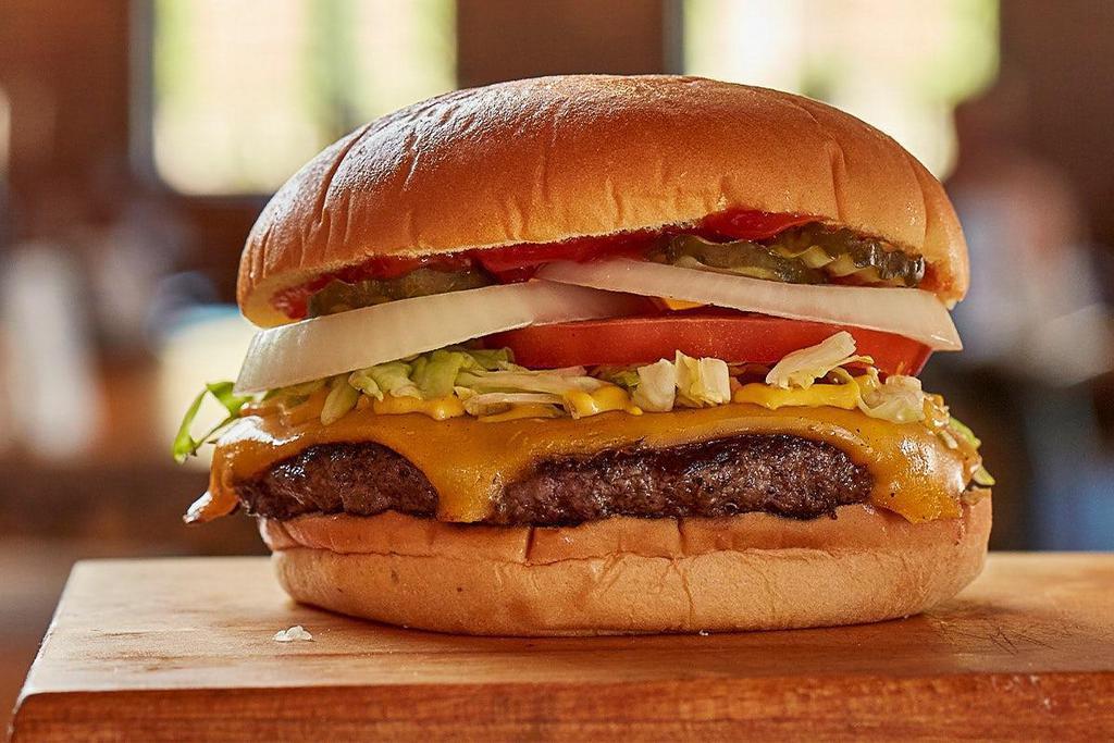 Jnn Original Burger · Melted American cheese, onions, lettuce, tomato, pickles, ketchup, mustard and mayo.