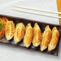 Gyoza (6) · Pork and vegetable dumpling. Served steamed or deep fried.