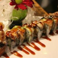 Dragon Roll · Raw/under cooked. 3 pcs shrimp tempura & cream cheese topped with shrimp, sweet shrimp & bla...