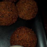 Falafel · Falafel are fried savory patties prepared with spiced chickpeas, fava beans, onions and fres...