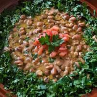 Foul Medames · This traditional Egyptian dish is a combination of fava beans, fresh garlic, lemon juice, di...