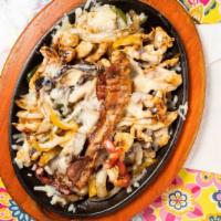 Lunch El Alambre · Strips of grilled, chicken, steak, bacon with melted cheese on top, served with rice, beans,...
