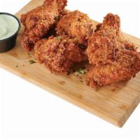 Chicken Wings / Alitas De Pollo · Six wings available in three flavors: Plain, Spicy or Guava BBQ