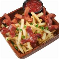 Salchipapa · French Fries with sliced sausages.
